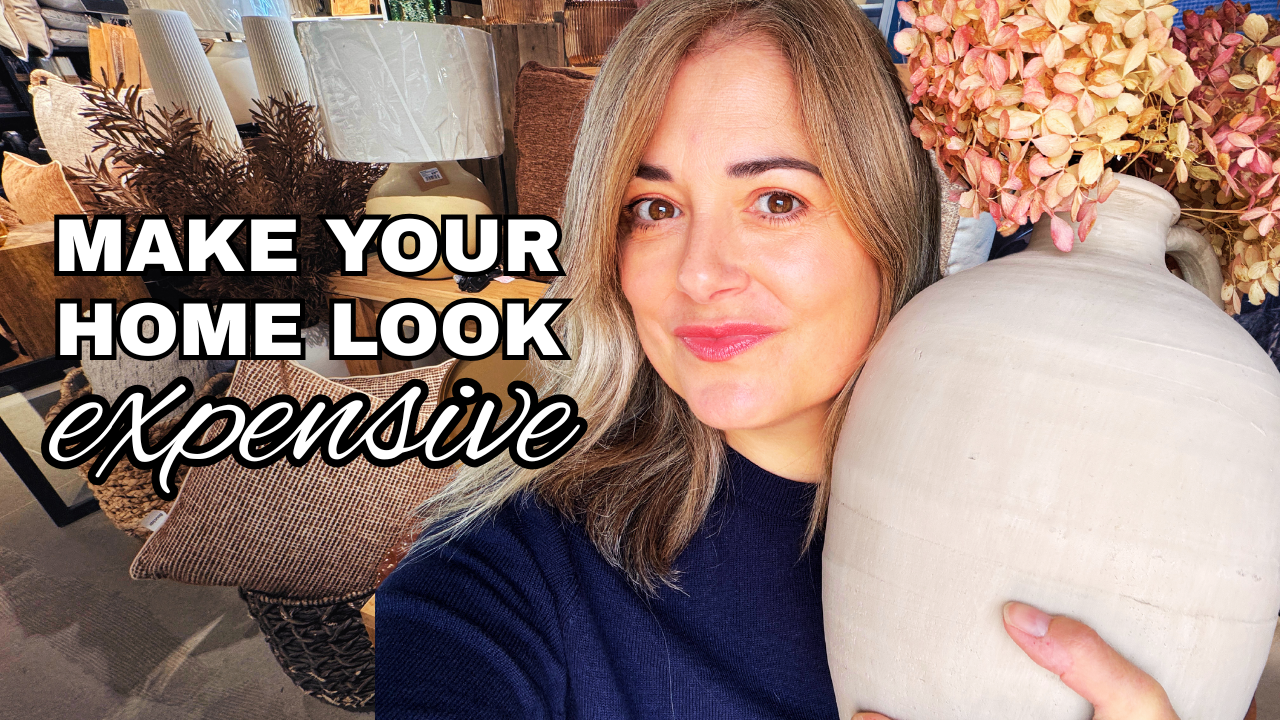 Sylvie holding a ceramic vase from Canada's Best Home Store